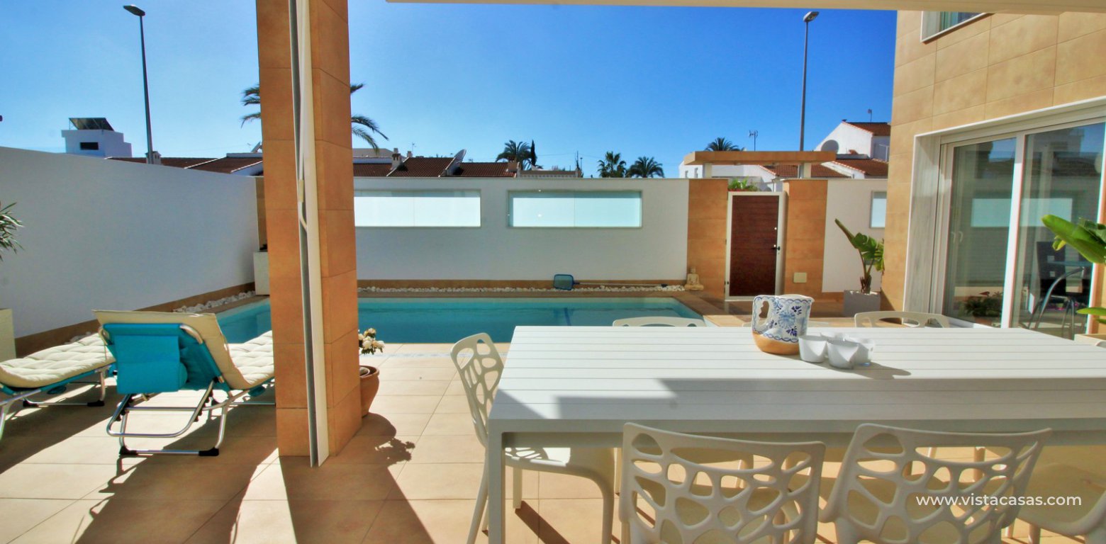 Luxury 5 bedroom detached villa with private pool for sale in Mil Palmeras covered terrace