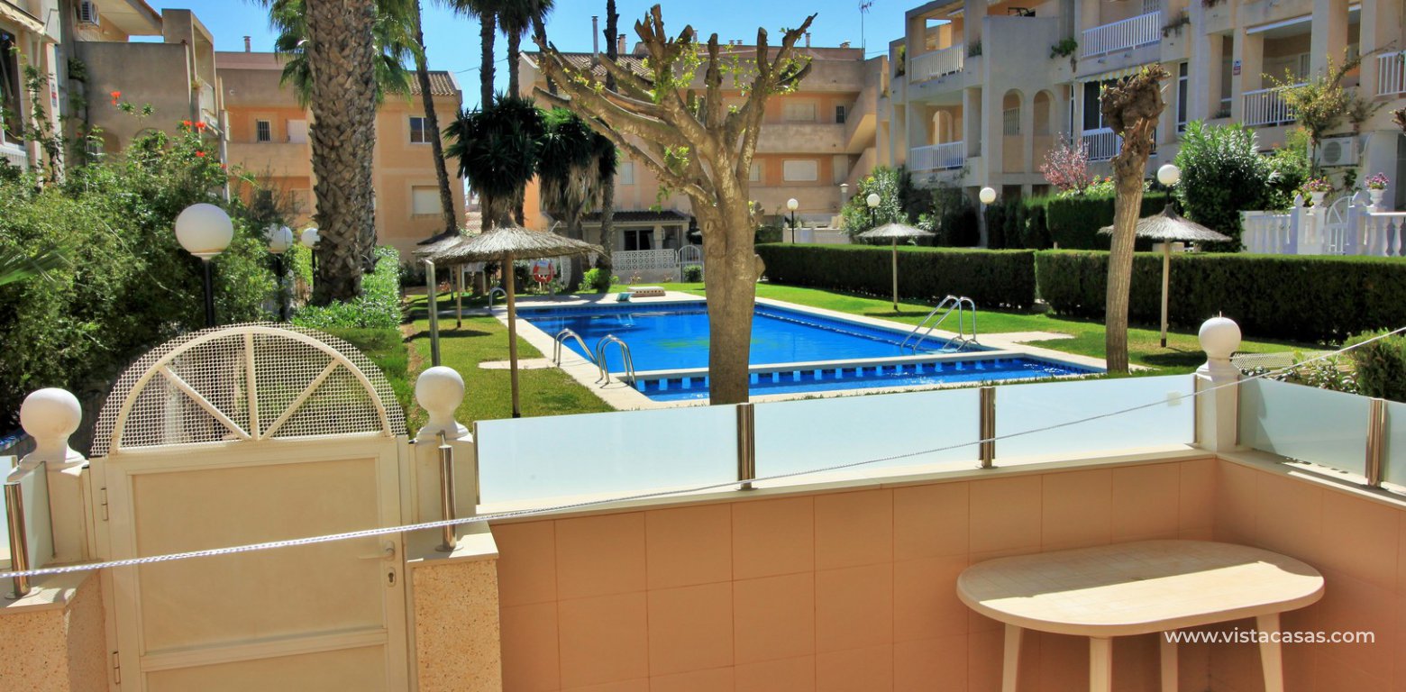 South facing 2 bedroom ground floor apartment directly facing the pool for sale in Los Frutales V La Rosaleda Torrevieja pool view