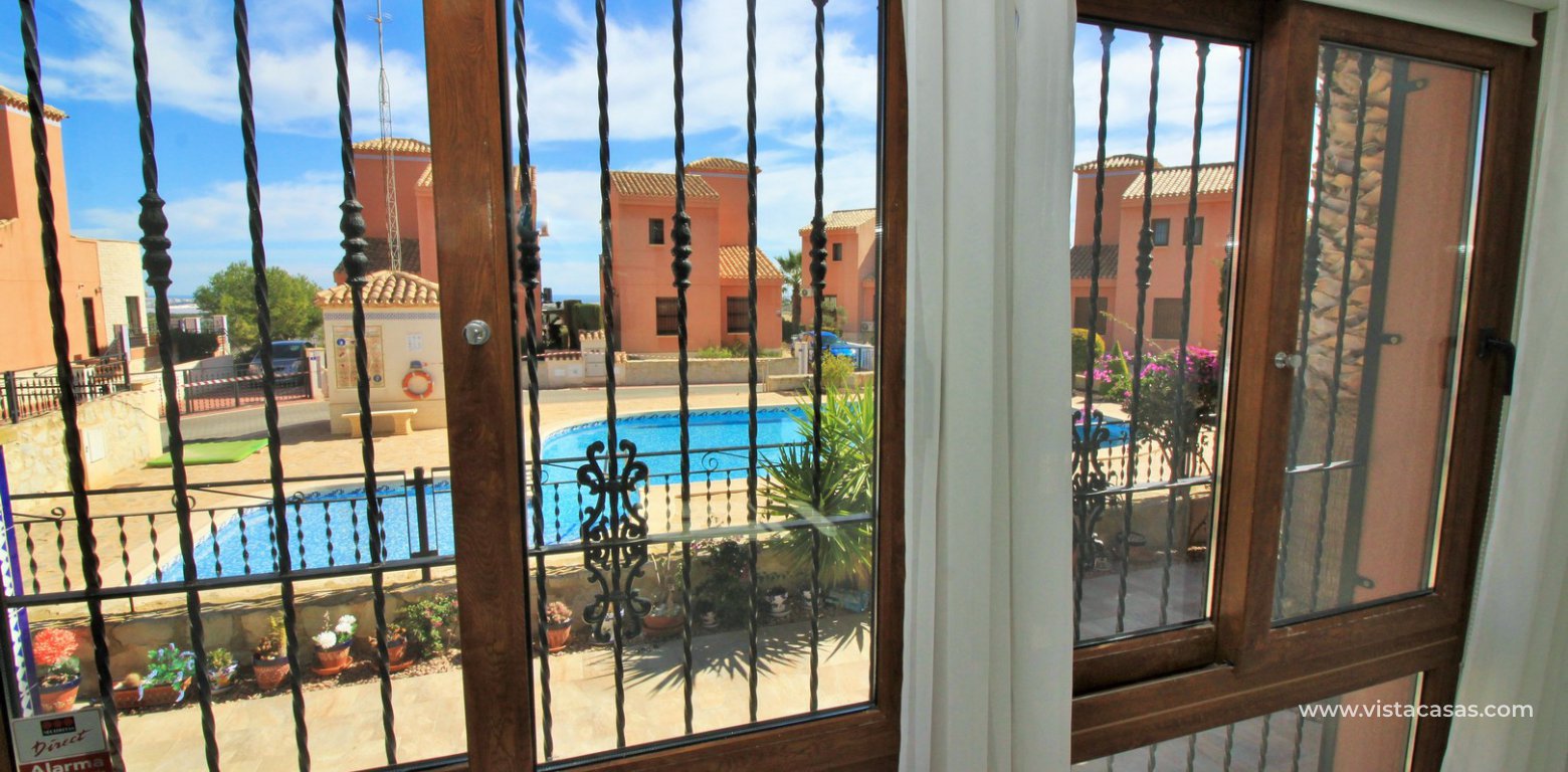 Detached villa overlooking the pool for sale in La Cañada San Miguel lounge pool view