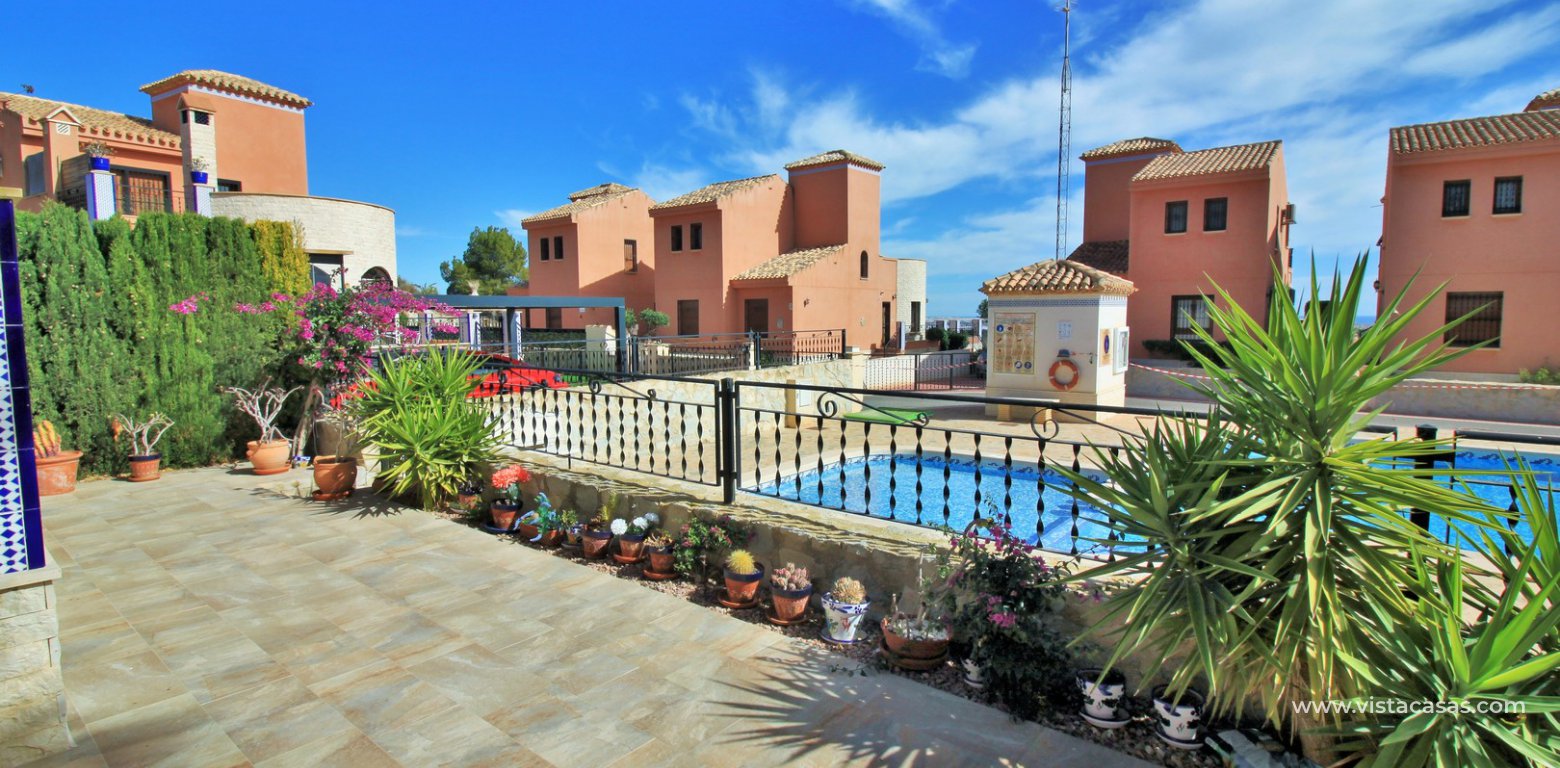 Detached villa overlooking the pool for sale in La Cañada San Miguel front tiled garden