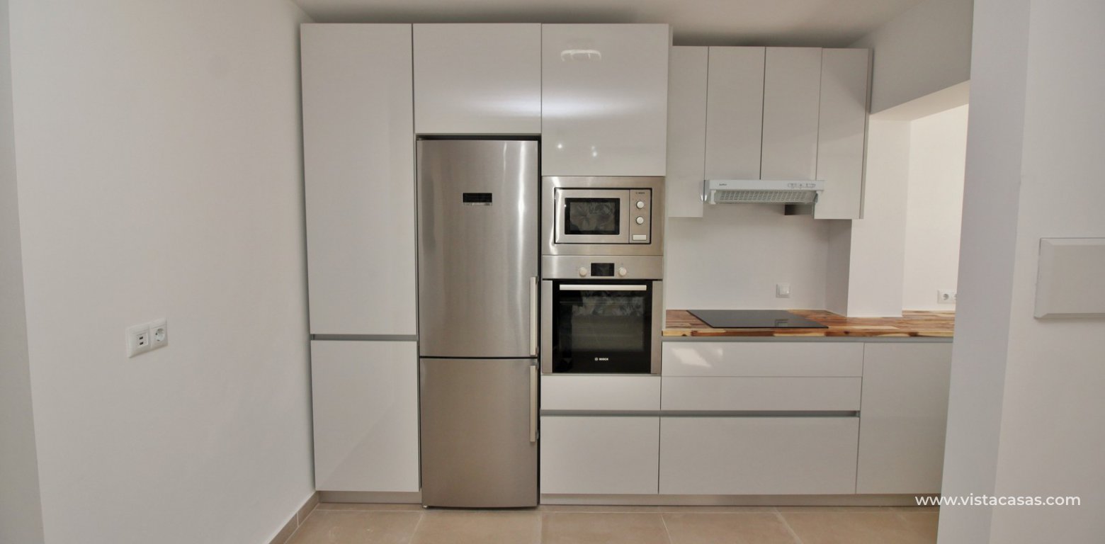 Modern South facing ground floor apartment for sale in Los Dolses kitchen