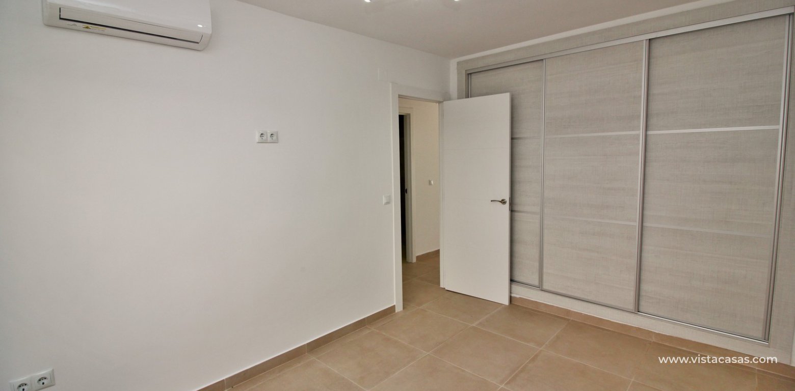 Modern South facing ground floor apartment for sale in Los Dolses master bedroom fitted wardrobes