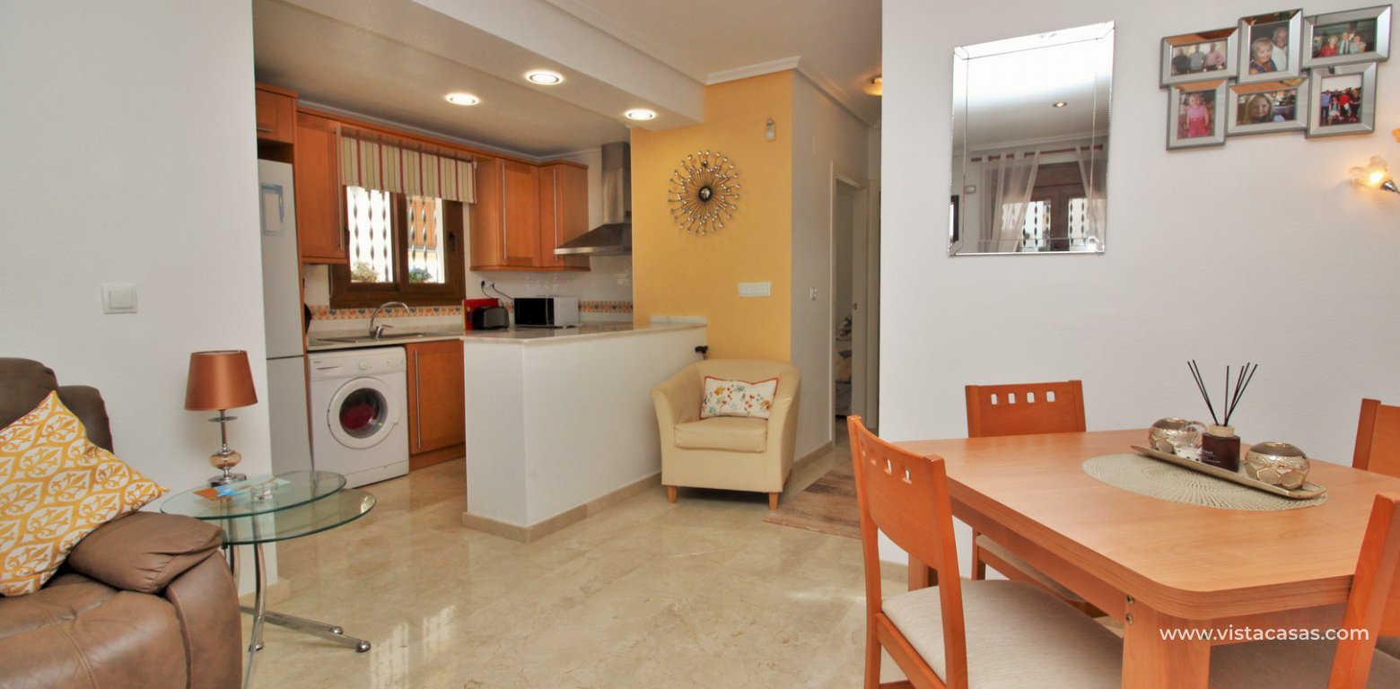 South facing ground floor apartment for sale overlooking the pool Pau 8 Villamartin dining area