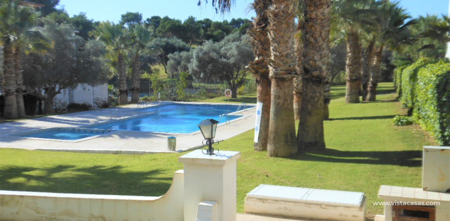Apartment for sale overlooking the pool in Villamartin communal pool