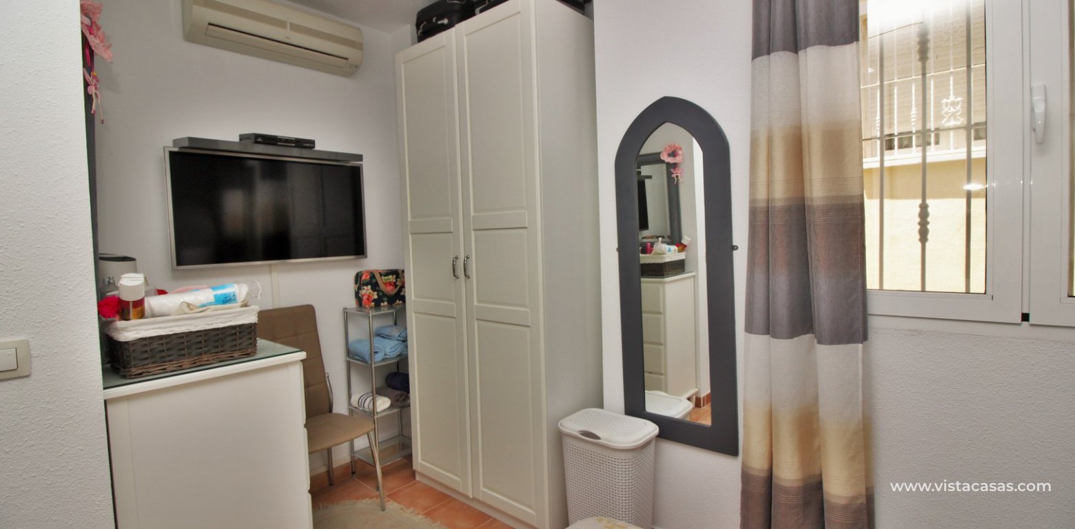 Modern top floor apartment for sale in Panorama Golf Villamartin master bedroom dressing area