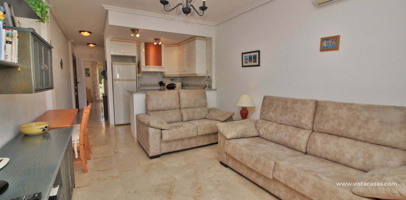 South facing apartment for sale Villamartin pool and golf views lounge