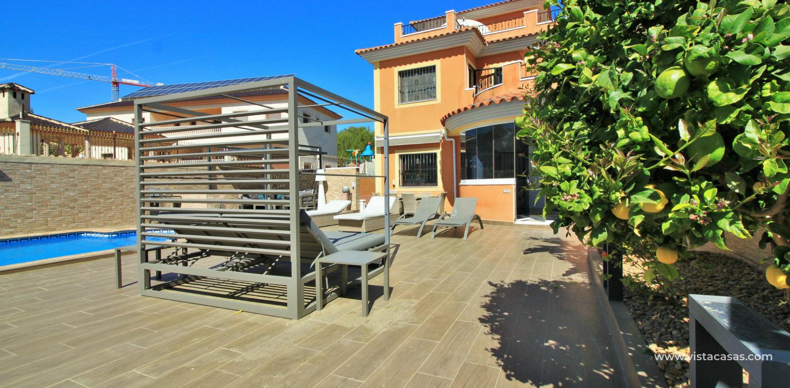 Modern 5 bedroom detached villa with private pool and large plot for sale Villamartin front garden