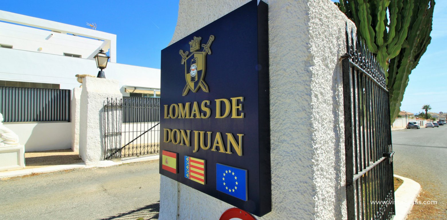 South facing renovated bungalow for sale Lomas de Don Juan Cabo Roig entrance gates