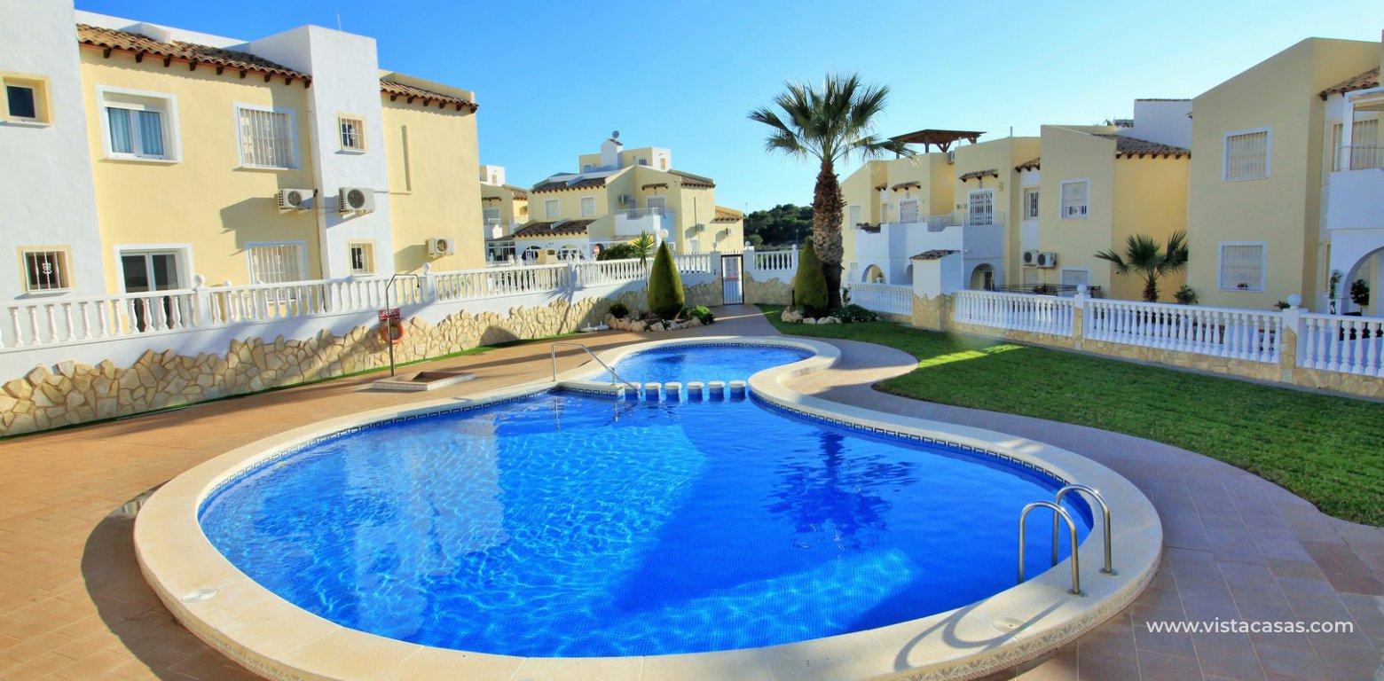 South facing 2 bedroom top floor apartment with golf views for sale in Panorama Golf Villamartin pool