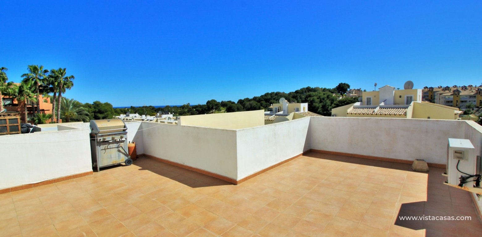 South facing 2 bedroom top floor apartment with golf views for sale in Panorama Golf Villamartin roof solarium