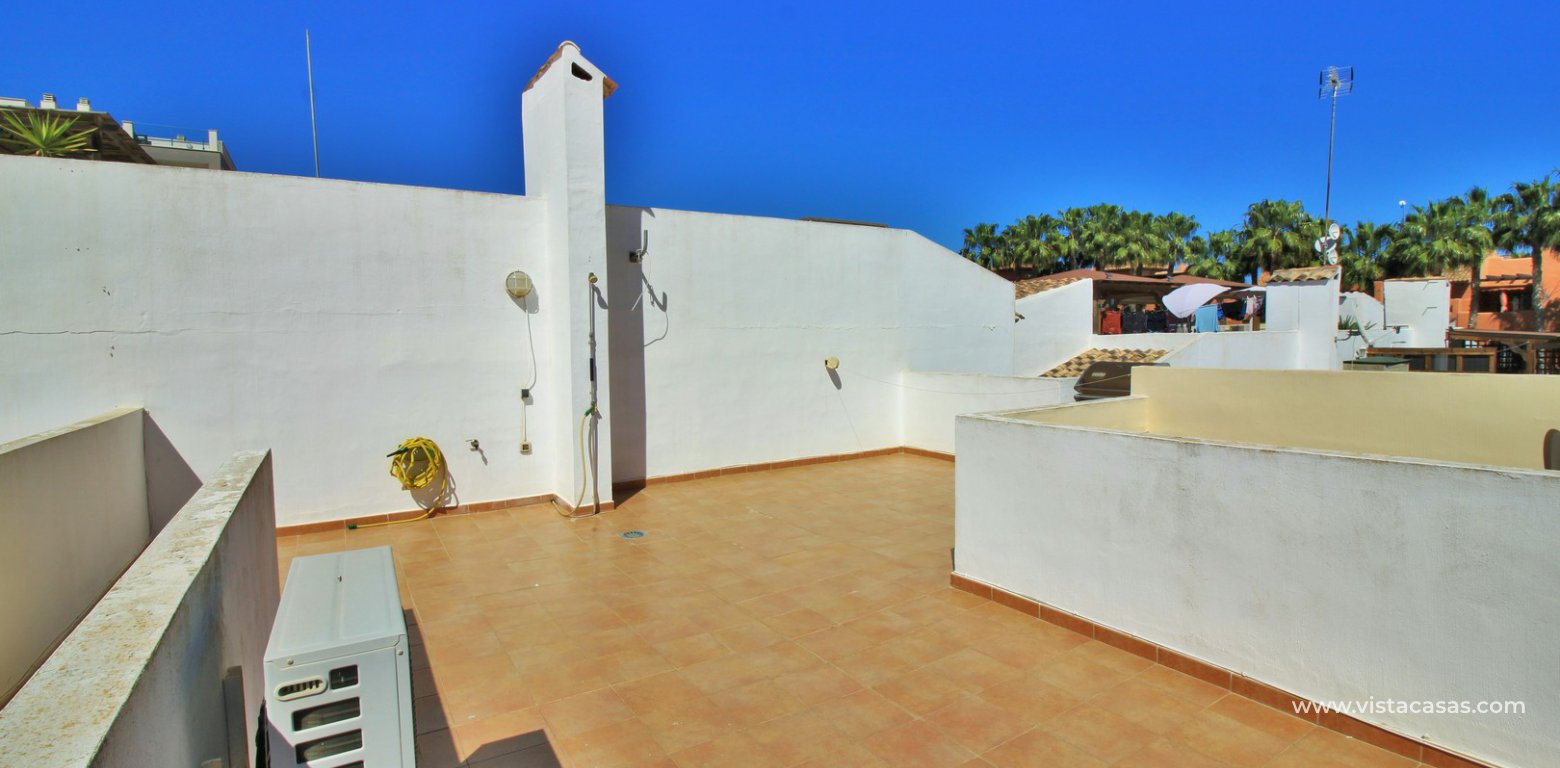 South facing 2 bedroom top floor apartment with golf views for sale in Panorama Golf Villamartin roof terrace