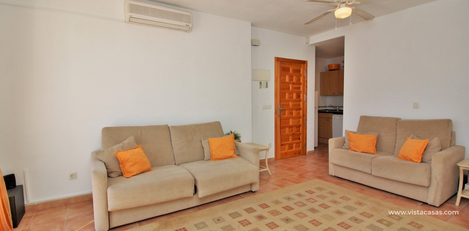 South facing 2 bedroom top floor apartment with golf views for sale in Panorama Golf Villamartin lounge 2