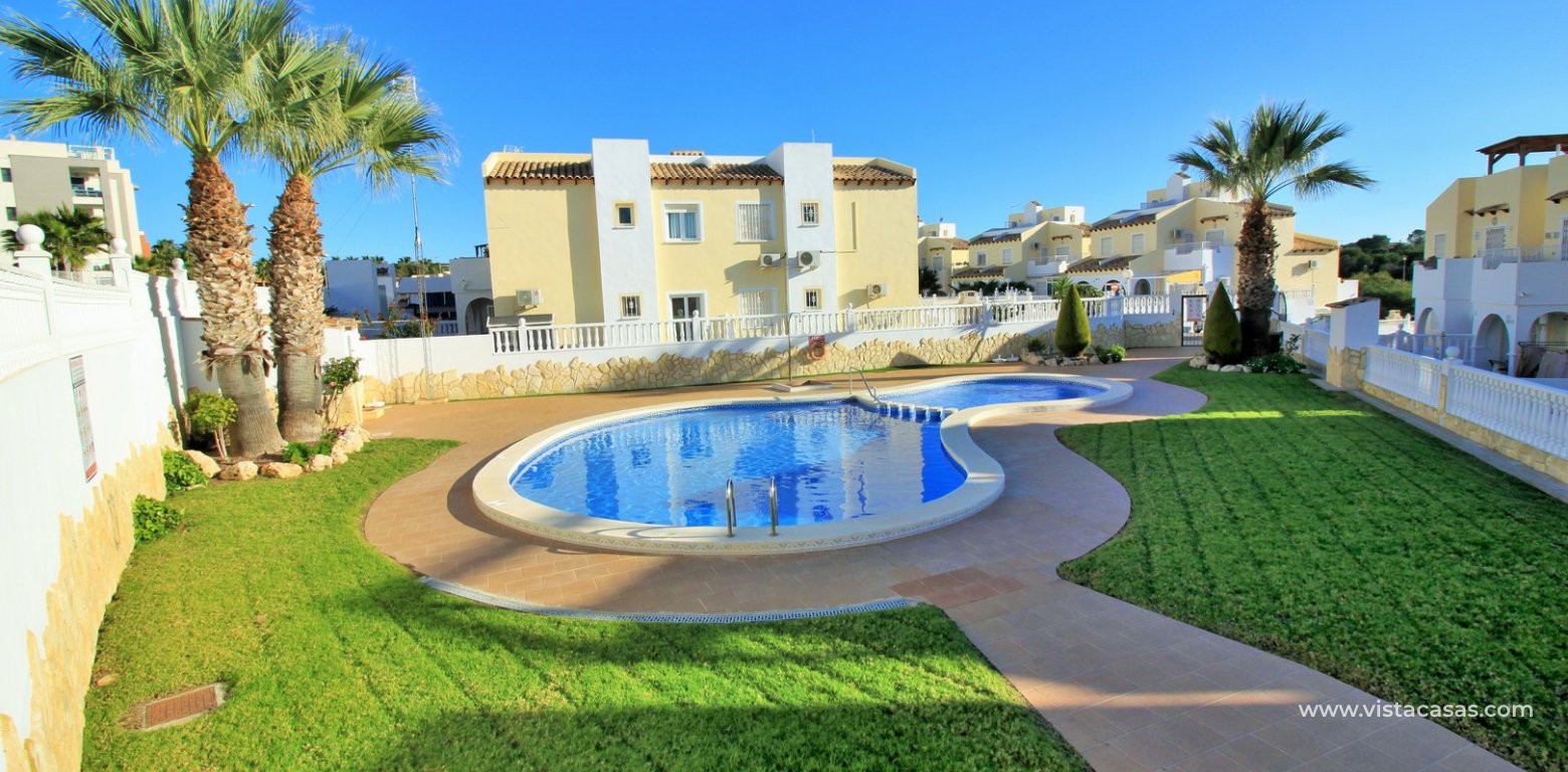 South facing 2 bedroom top floor apartment with golf views for sale in Panorama Golf Villamartin communal pool