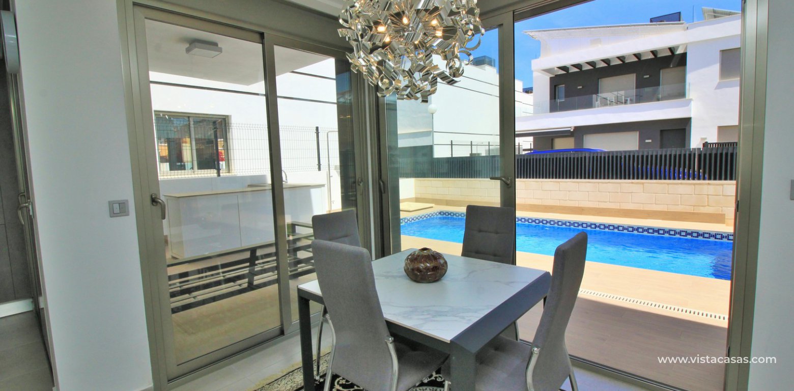 Detached villa with private pool for sale Villamartin dining area pool