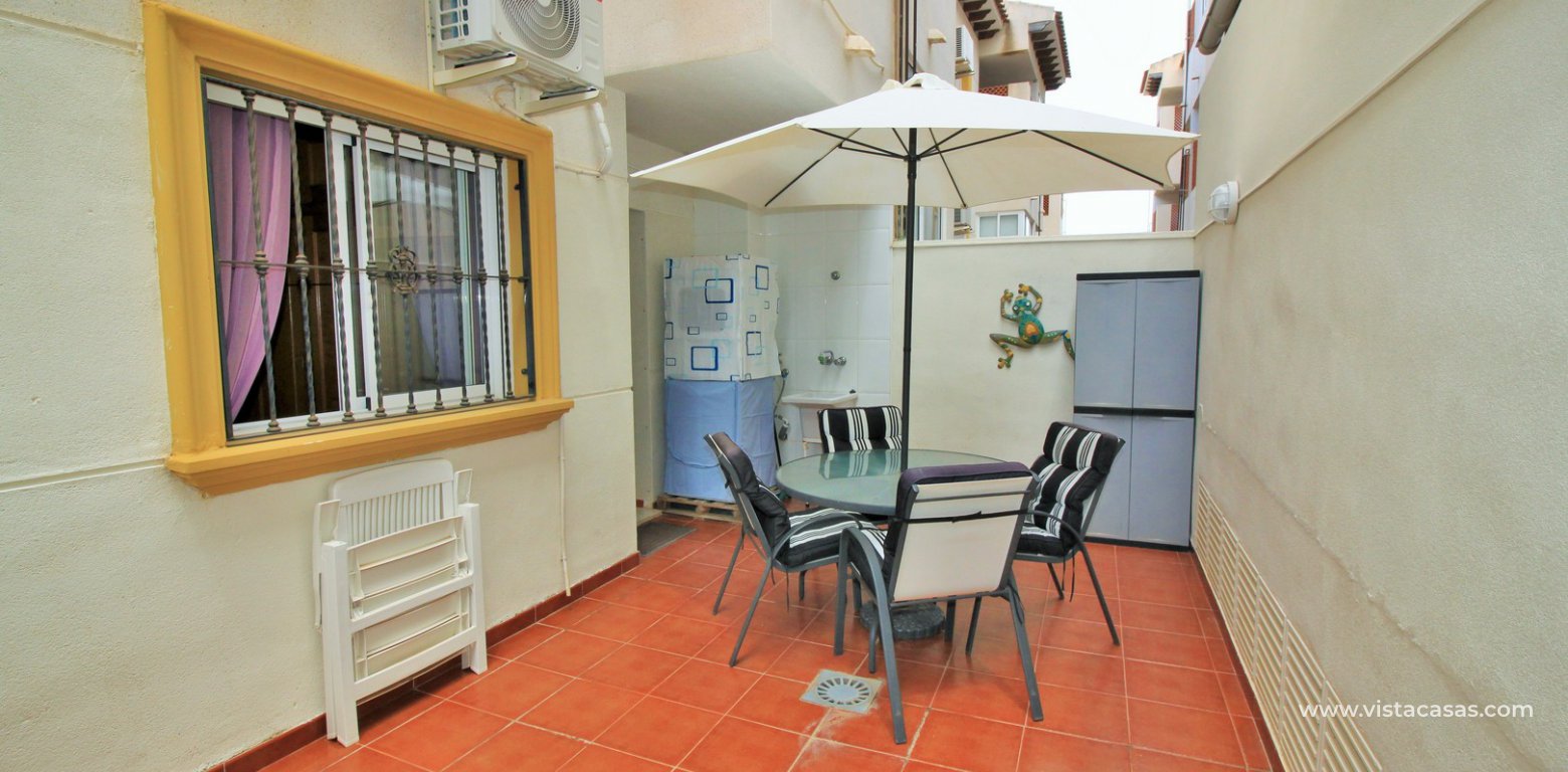 Ground floor apartment for sale Pinada Golf Villamartin rear terrace