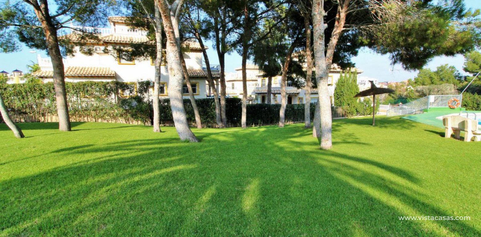 Quad house for sale Pinada Golf II Villamartin communal pool and gardens