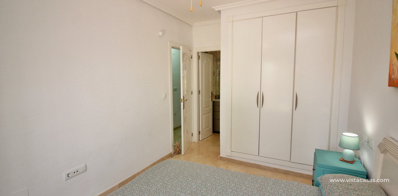 South facing Lola bungalow for sale calle Nabucco Pau 8 Villamartin master bedroom fitted wardrobes