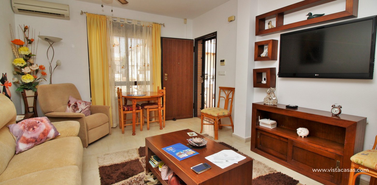 3 bedroom villa for sale overlooking the pool El Palmeral Pau 8 Villamartin lounge 3