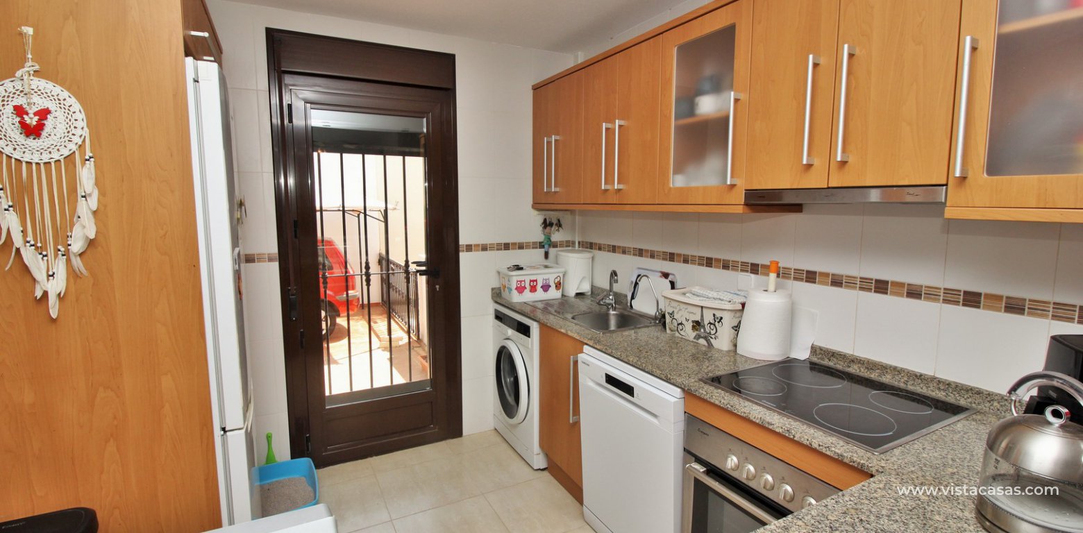 3 bedroom villa for sale overlooking the pool El Palmeral Pau 8 Villamartin kitchen