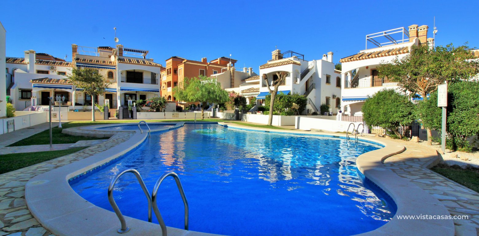 Ground floor corner apaertment overlooking the pool for sale pau 8 villamartin community pool