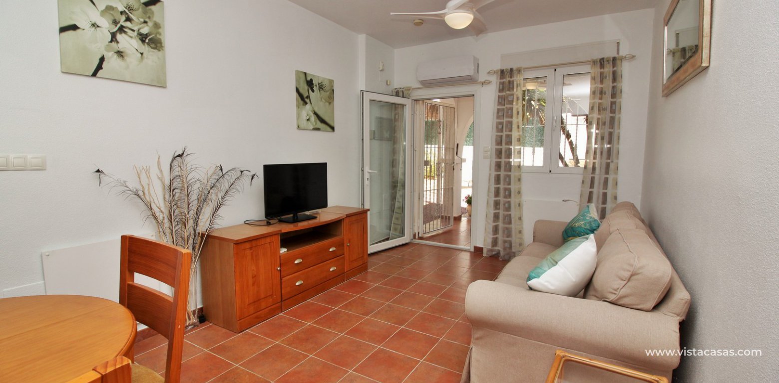 Ground floor apartment with communal pool for sale Panorama Golf Villamartin lounge 3