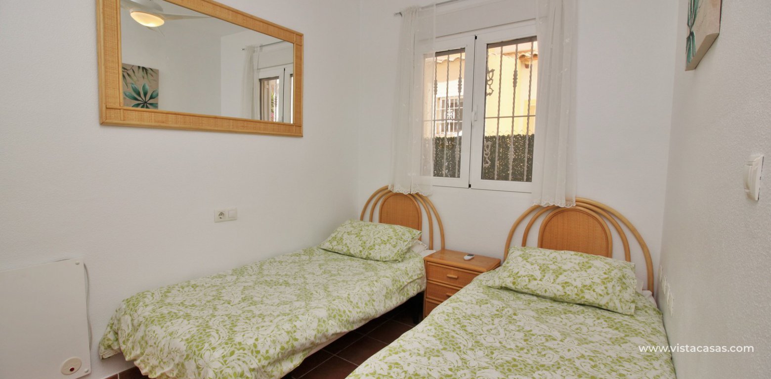 Ground floor apartment with communal pool for sale Panorama Golf Villamartin twin bedroom