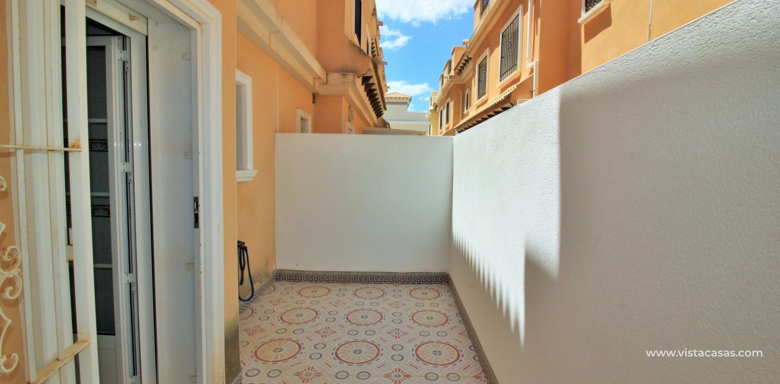 South facing 3 bedroom townhouse for sale Entregolf Villamartin rear terrace