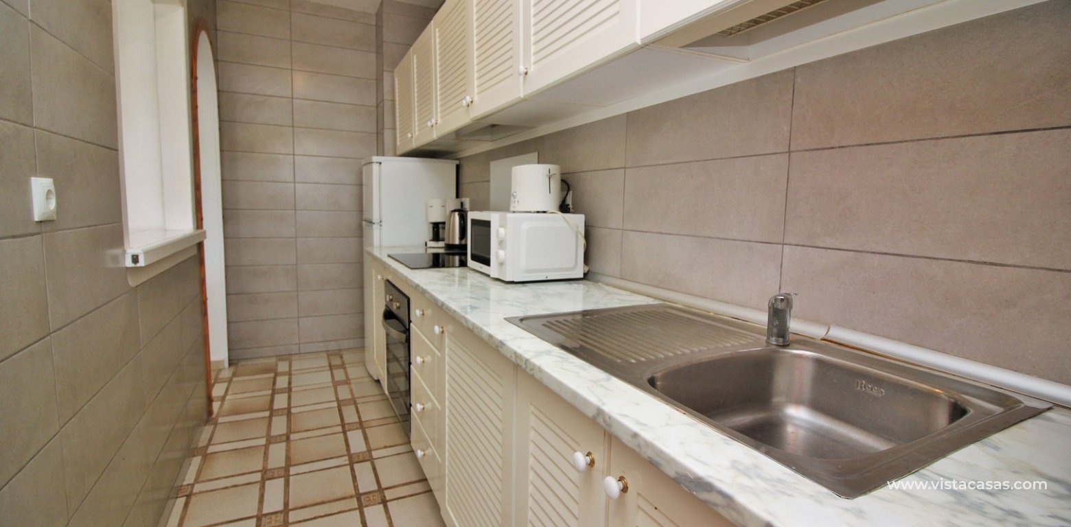 Apartment for sale with pool view in the Villamartin Plaza fitted kitchen