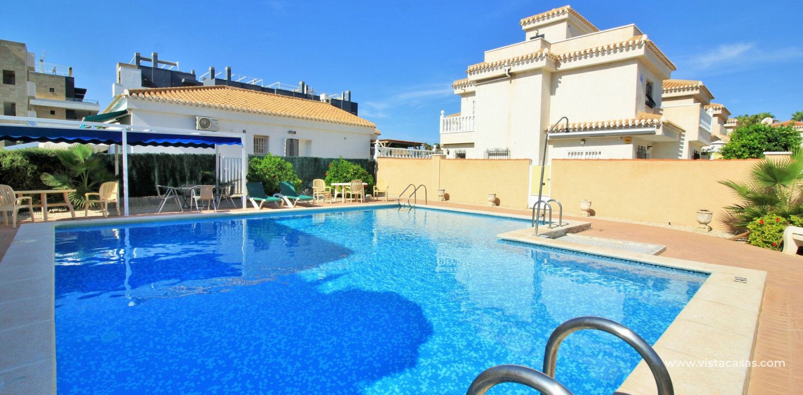 3 bedroom quad house for sale Vistaluz Playa Flamenca communal swimming pool