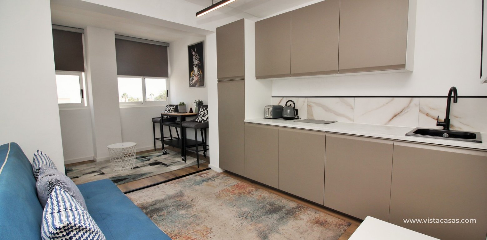 Renovated apartment for sale in the Villamartin Plaza living room kitchen