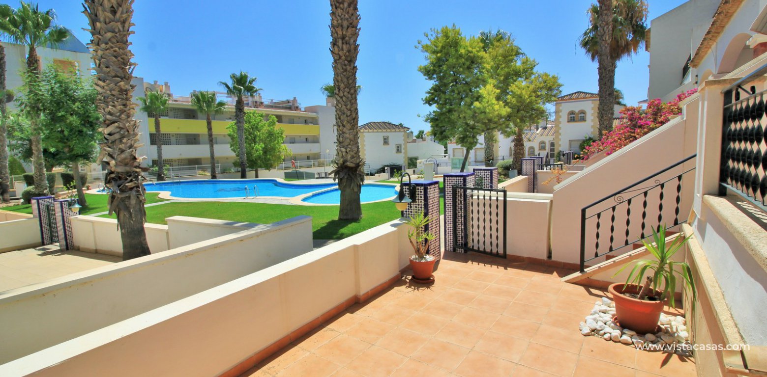 Townhouse for sale in Villamartin front garden pool view