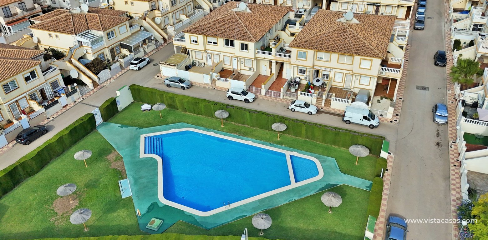 Top floor apartment for sale Sol de Mar Playa Flamenca pool aerial