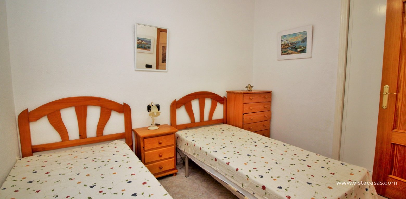 South facing townhouse for sale Playa Flamenca Vistacasas twin bedroom fitted wardrobes