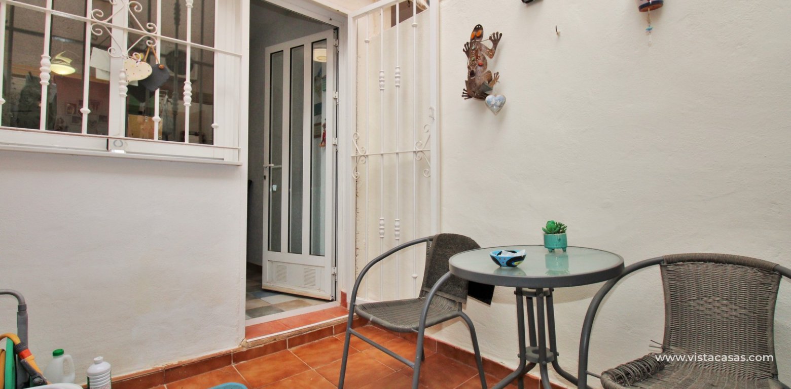 Townhouse for sale in Amapolas VII Playa Flamenca rear utility area