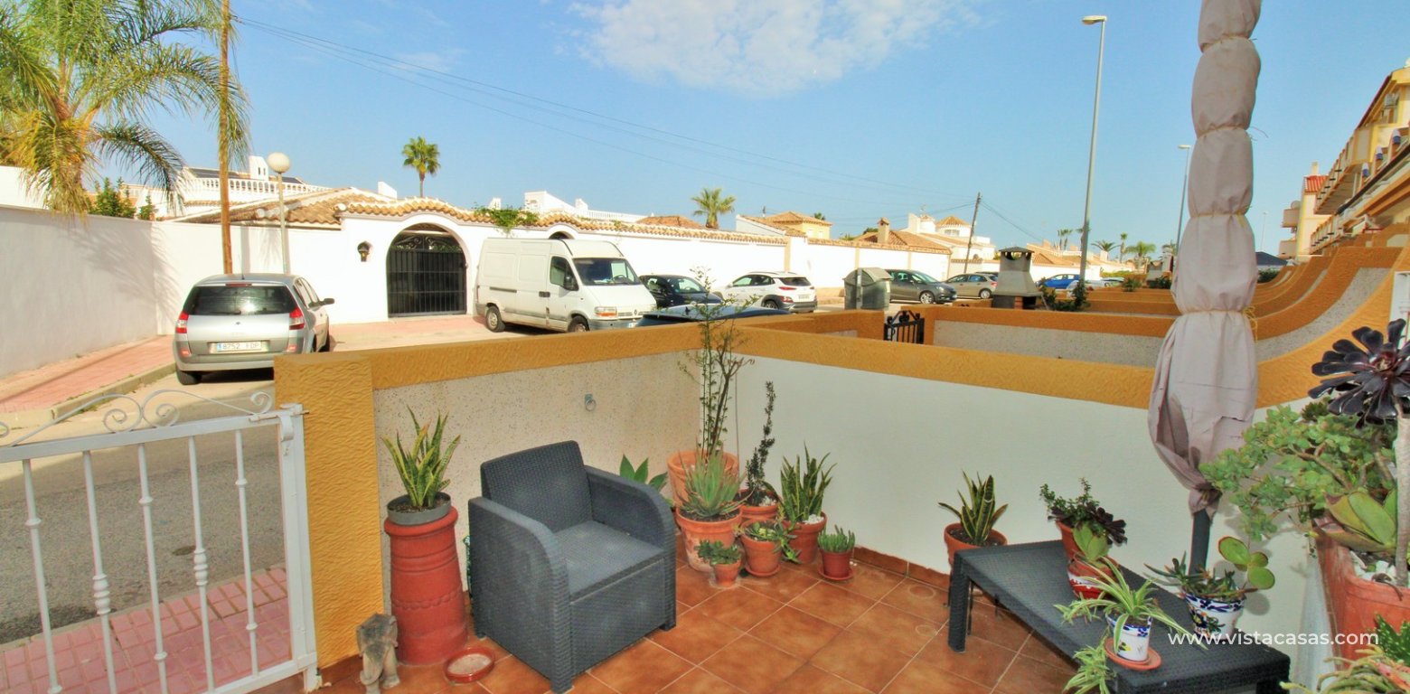 Townhouse for sale in Amapolas VII Playa Flamenca tiled garden