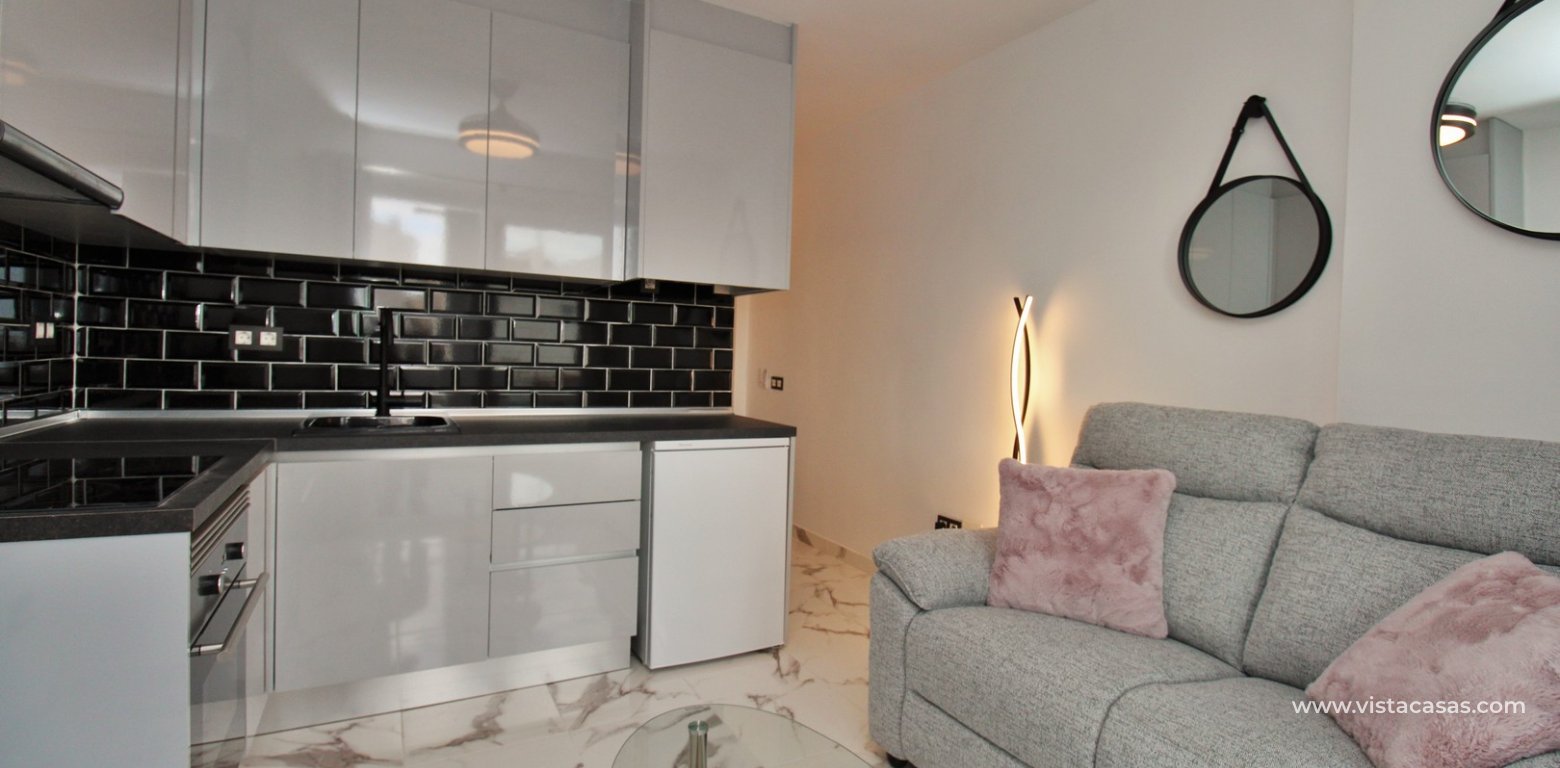 Renovated apartment for sale in the Villamartin Plaza living room kitchen