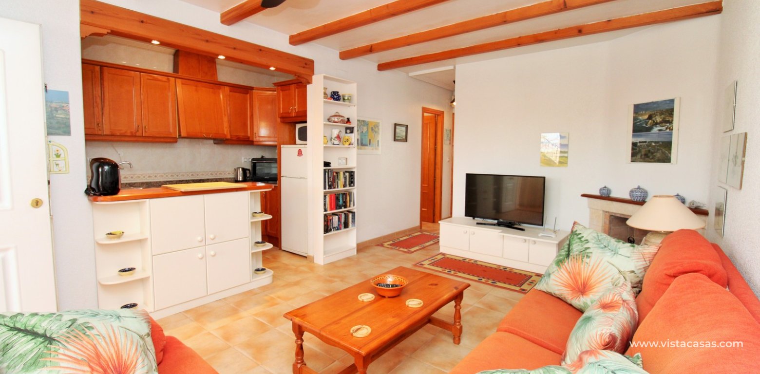 Villamartin 2 bed bungalow monte golf roof terrace pool for sale lounge 2