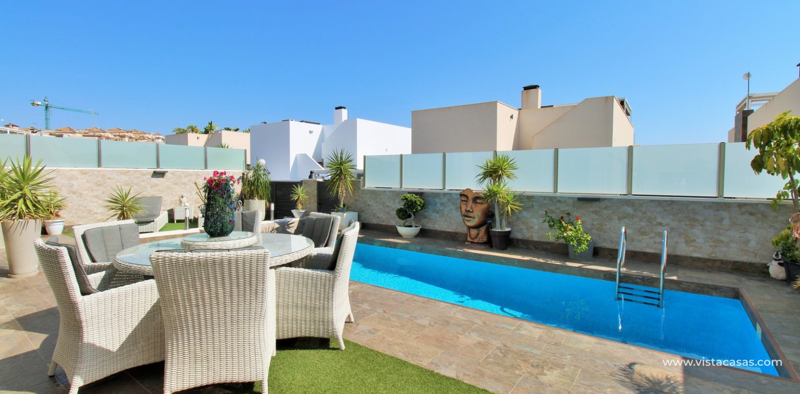 Modern 4-Bed Villa with Pool & Solarium in Villamartin pool seating