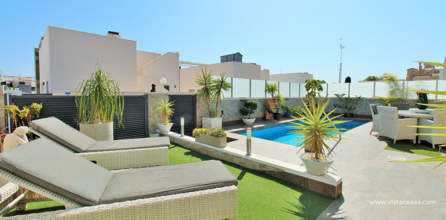 Modern 4-Bed Villa with Pool & Solarium in Villamartin sun loungers