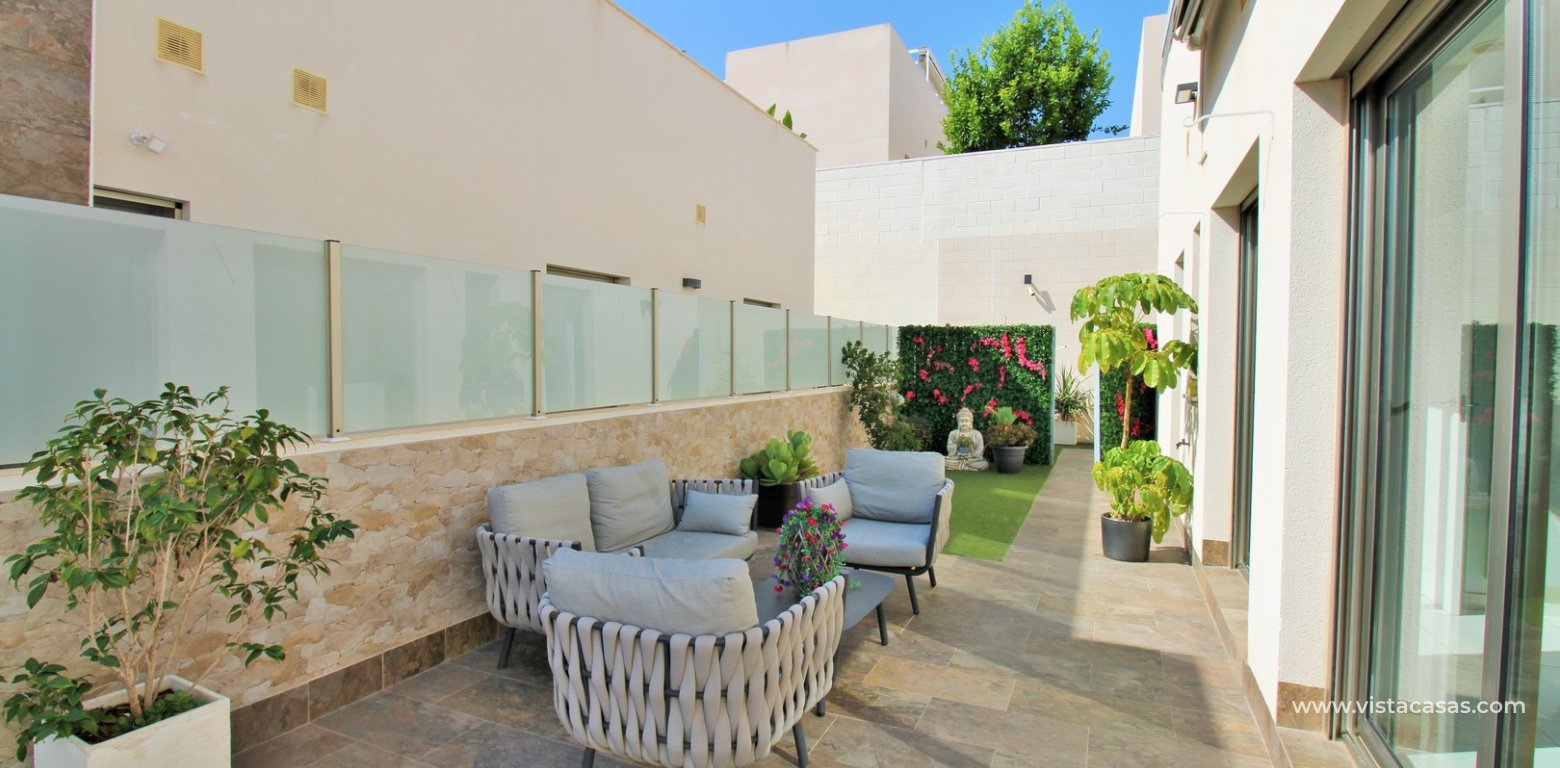 Modern 4-Bed Villa with Pool & Solarium in Villamartin garden seating