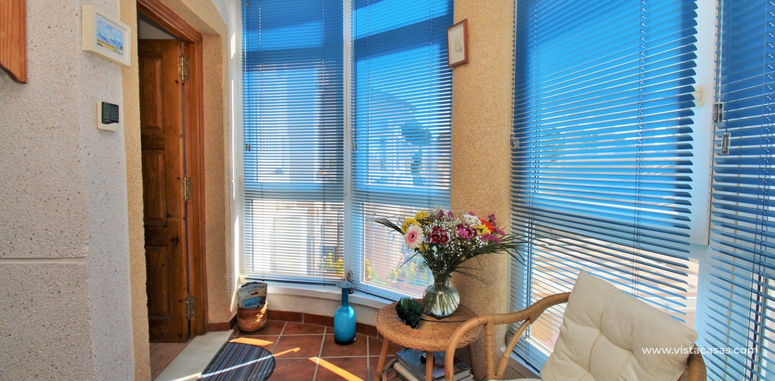 South-Facing 2 Bed Bungalow For Sale in Loma Golf Villamartin enclosed balcony