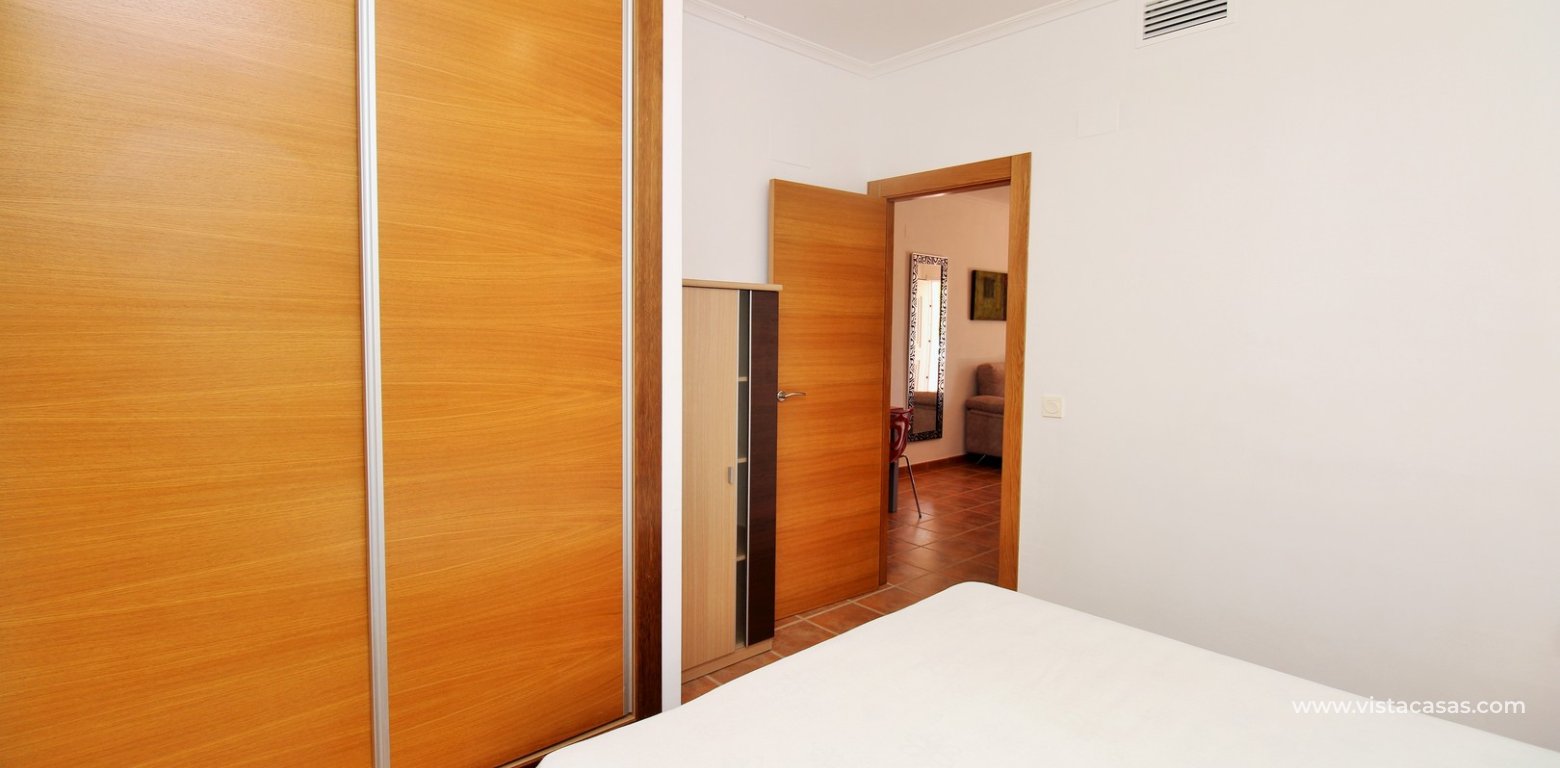 South-Facing Beachside Bungalow For Sale in Res. Leman Mil Palmeras master bedroom fitted wardrobes