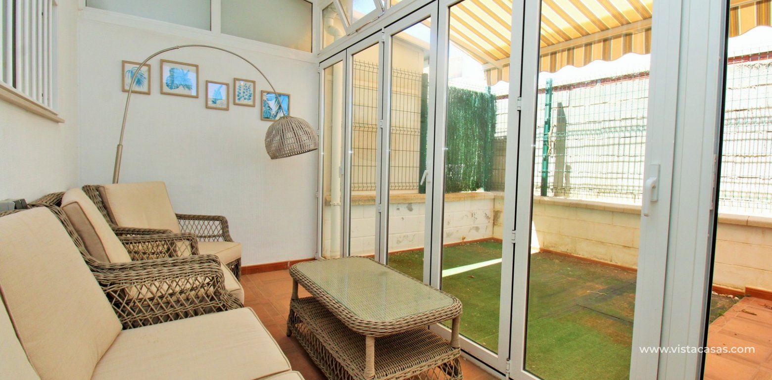 South-Facing Beachside Bungalow For Sale in Res. Leman Mil Palmeras conservatory