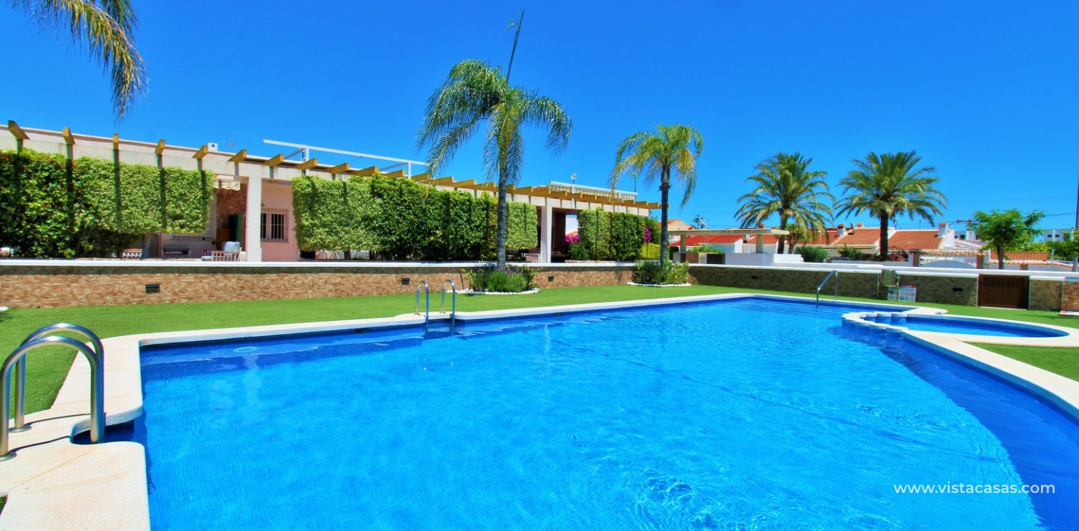 South-Facing Beachside Bungalow For Sale in Res. Leman Mil Palmeras communal swimming pool