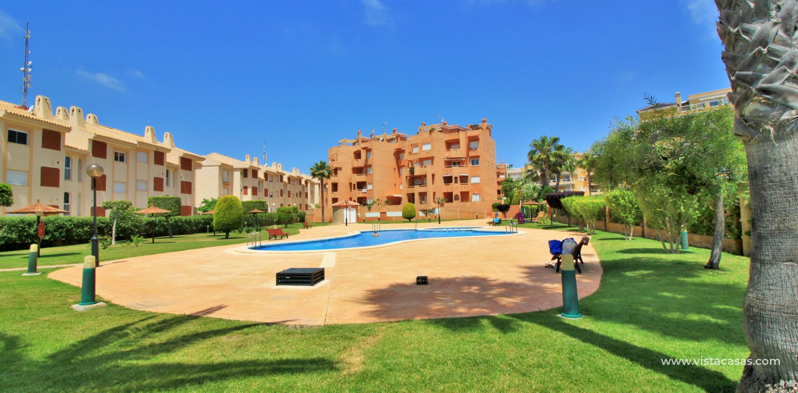 Apartment for sale in Las Calitas Cabo Roig communal pool and gardens
