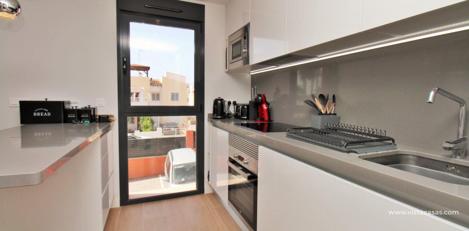 Modern 2 Bed Apartment For Sale in Palapa Golf Villamartin kitchen 3