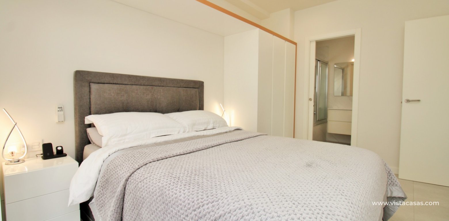 2 Bedroom Pool View Apartment For Sale In Mirador de Villamartin Los Dolses master bedroom fitted wardrobes