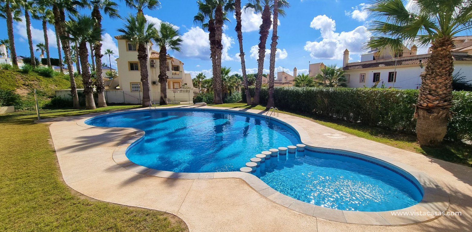 Detached villa with pool for sale in Villamartin communal pool