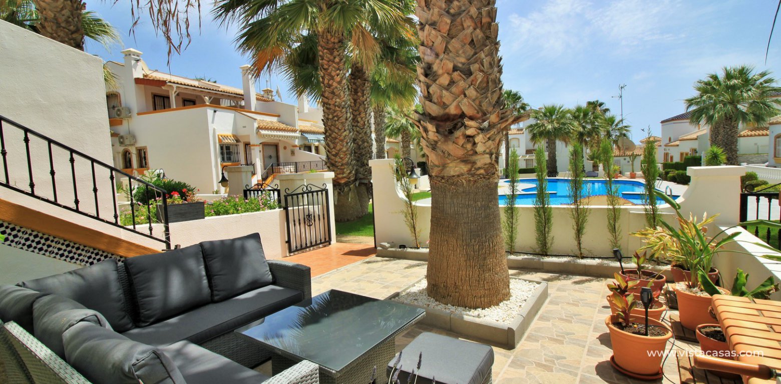 Lola bungalow for sale overlooking the pool in R12/13 Los Dolses front garden pool view