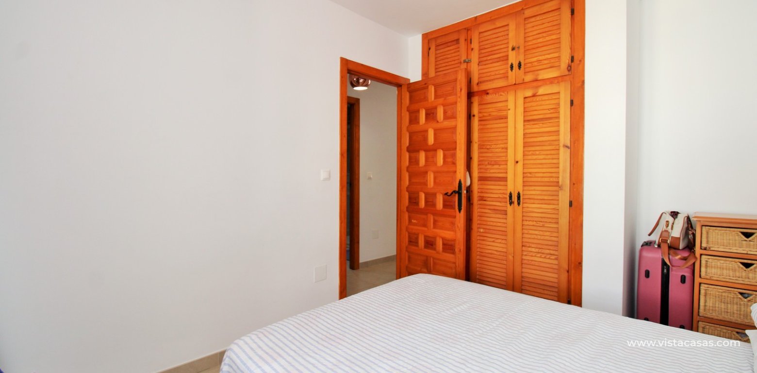 South-Facing Lola Bungalow For Sale in Verdemar III Villamartin master bedroom fitted wardrobes